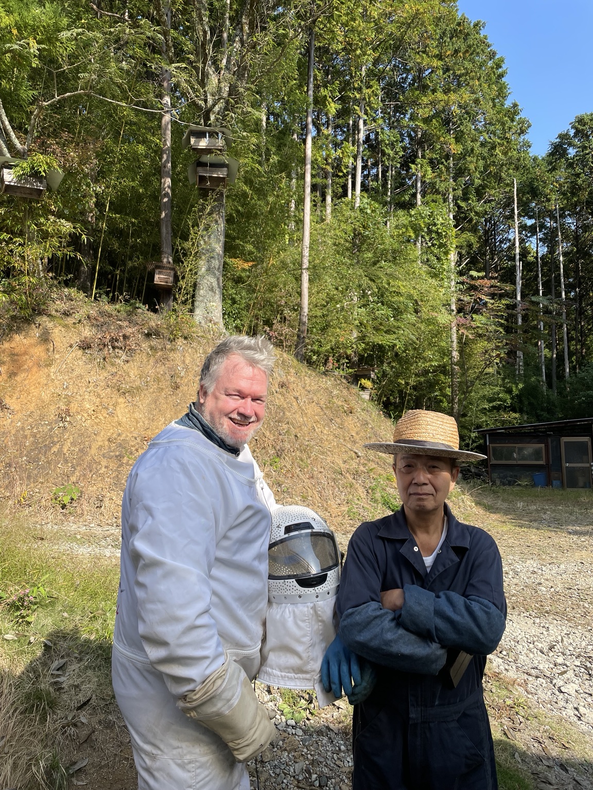 Two field specialists with protective equipment in rural Japan